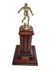 Most Progressive Player H. Henderson 1988/86 Trophy on Wooden Base 350 mm High
