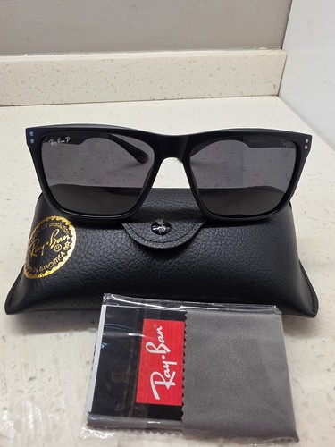 Ray ban sunglasses worn - -,