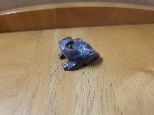 Hand craved stone frog - hand,