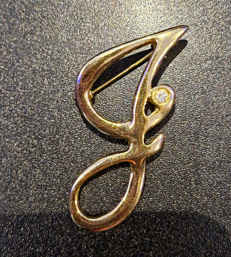 Gold tone letter brooch - tone,