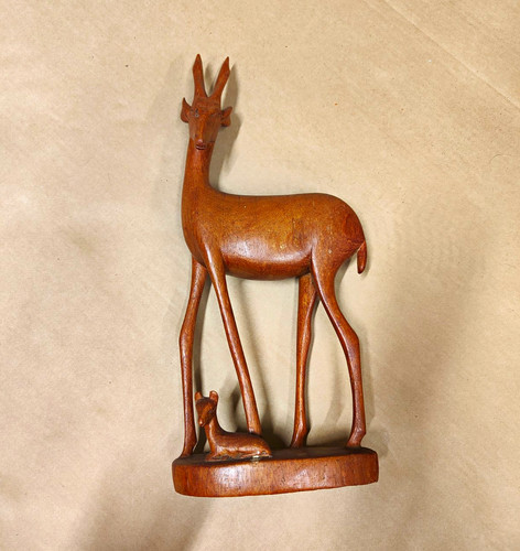 Hand carved wooden deer - hand,