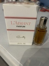 COTY L'AIMANT PARFUM .25 OZ