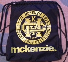 McKenzie Black With yellow Logo Drawstring Bag Zip Pocket Adjustable Strap