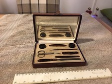 Vintage faux tortoishell 8 piece manicure set in box with mirror back plate