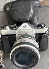 Pentax SP1000 Camera with Manual, Lens, and Cap