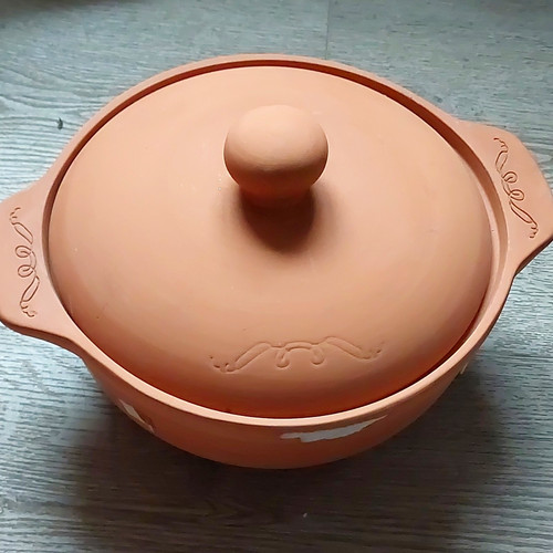 Terracotta clay pot with meat