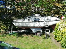 Leisure 17 sailing boat with original trailer sails and 4hp outboard motor