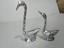 Swans, two silver coloured metal swans, ornaments