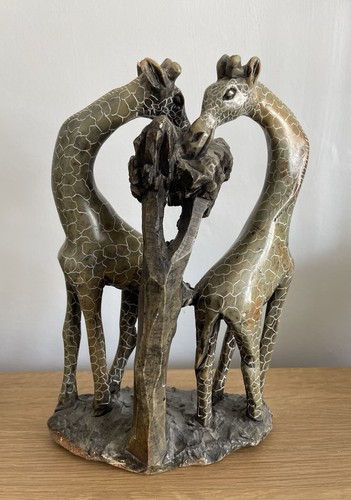 Hand carved loving giraffes - hand,