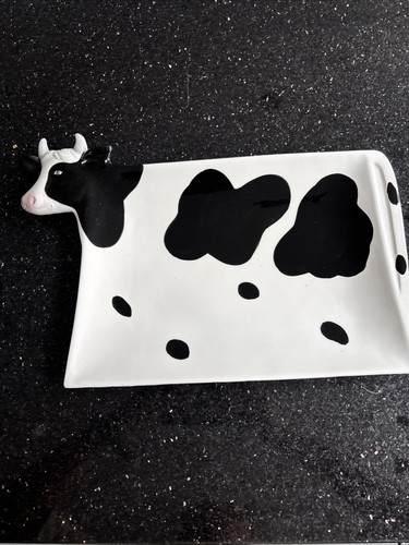 Cow now large black and - now,