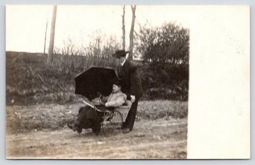 Rppc man pushes his - pushes, mother