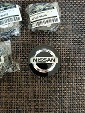  Genuine Nissan black  set of 4 Alloy Wheel Centre  caps  54mm 40342-JD18A