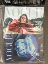 New unopened Vogue magazine December 2025 with blue bag diary