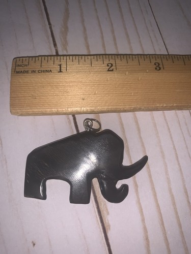 Hand carved symbolic mammoth - hand,