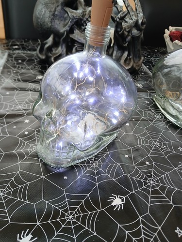 Empty glass skull bottle - empty,
