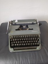 Vintage 1957 Olympia SG-1 Deluxe Typewriter in Green, Germany, no case.