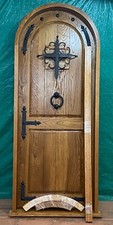 Rustic oak lumber arch door