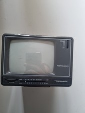 Vintage Portavision portable black and white TV with AM FM radio.  Model O2T525