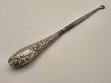Ornate silver handled button hook, W J Myatt & Co, Birmingham 1906, 8in