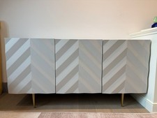 Beautiful Grey sideboard with textured doors. Brass details. Bought from Swoon. 