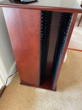 Rotating C D storage cabinet in mahogany 710 mm H x top 345 mm square D/ W.