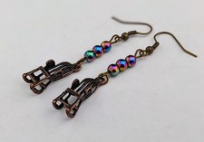 Bronze rocking chair earrings with rainbow Mardi Gras beads