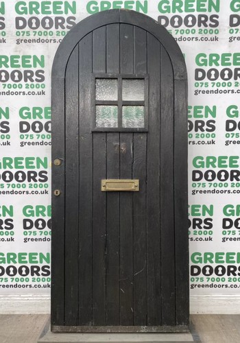 Arched wooden front door - wooden,