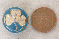 A 1994 - 2005 brass and gilt on dark blue mock enamel Girl Guide Promise badge.
