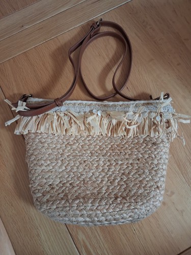 Small raffia across body - across,