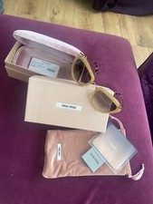 Gold glitter rimmed Miu Miu sunglasses 