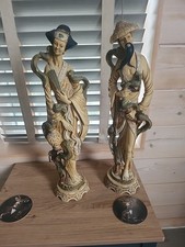 Two Tall Oriental Figurines