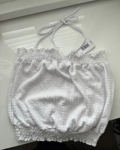 White top with tags from - with, on