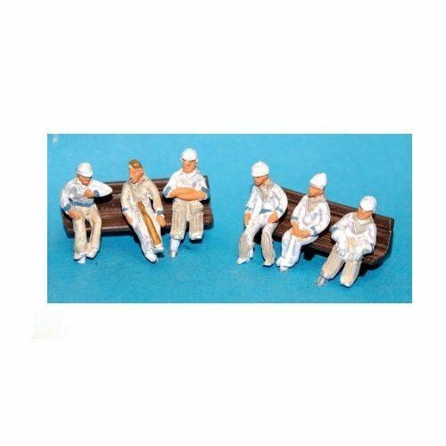 Seated cricketers waiting - cricketers,