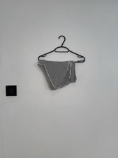 grey and white shorts, size