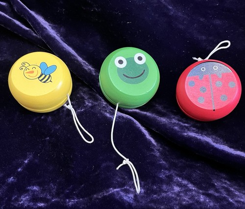 Three wooden colourful - yo, yo