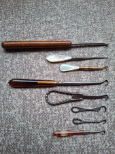8 Antique and vintage button nooks and crochet hooks.