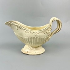 A finely moulded silver-shape fluted Leeds Pottery creamware sauceboat c1775-85