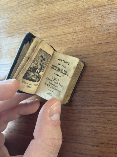 Miniature book history of - miniature,