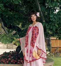 Joan Collins wearing the