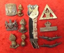 Assorted military badges as