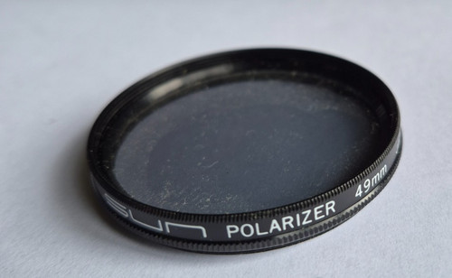 Polarising lens filter for - lens,