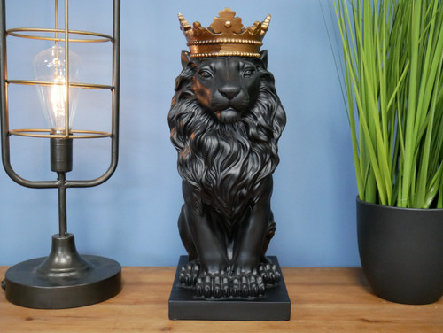 Black sitting lion with crown - lion,