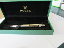 A BRAND NEW PALLADIUM PLATED ROLEX BALLPOINT IN A LUXURY PEN CASE WITH PEN SLIP
