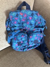 Kipling City Pack S With blue and pink Monkey print. The Monkey is Daisy.