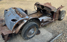 Triumph TR3 rolling chassis on wire wheels with various spares