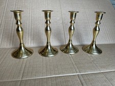Four Brass Candle Holders, pre-owned. Height 170mm, base dia. 75mm.