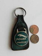 A VINTAGE LEATHER KEY FOB w/ ENAMEL BADGE, "JAGUAR" WESTOVER. CARS.