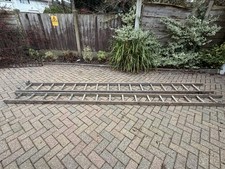 Double extending wooden ladder