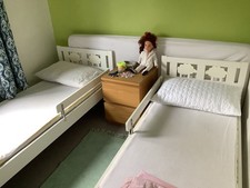 Pair of Ikea kritter beds in white with mattresses and mattress covers