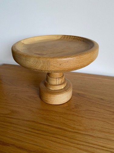 Hand turned solid oak cake - hand,